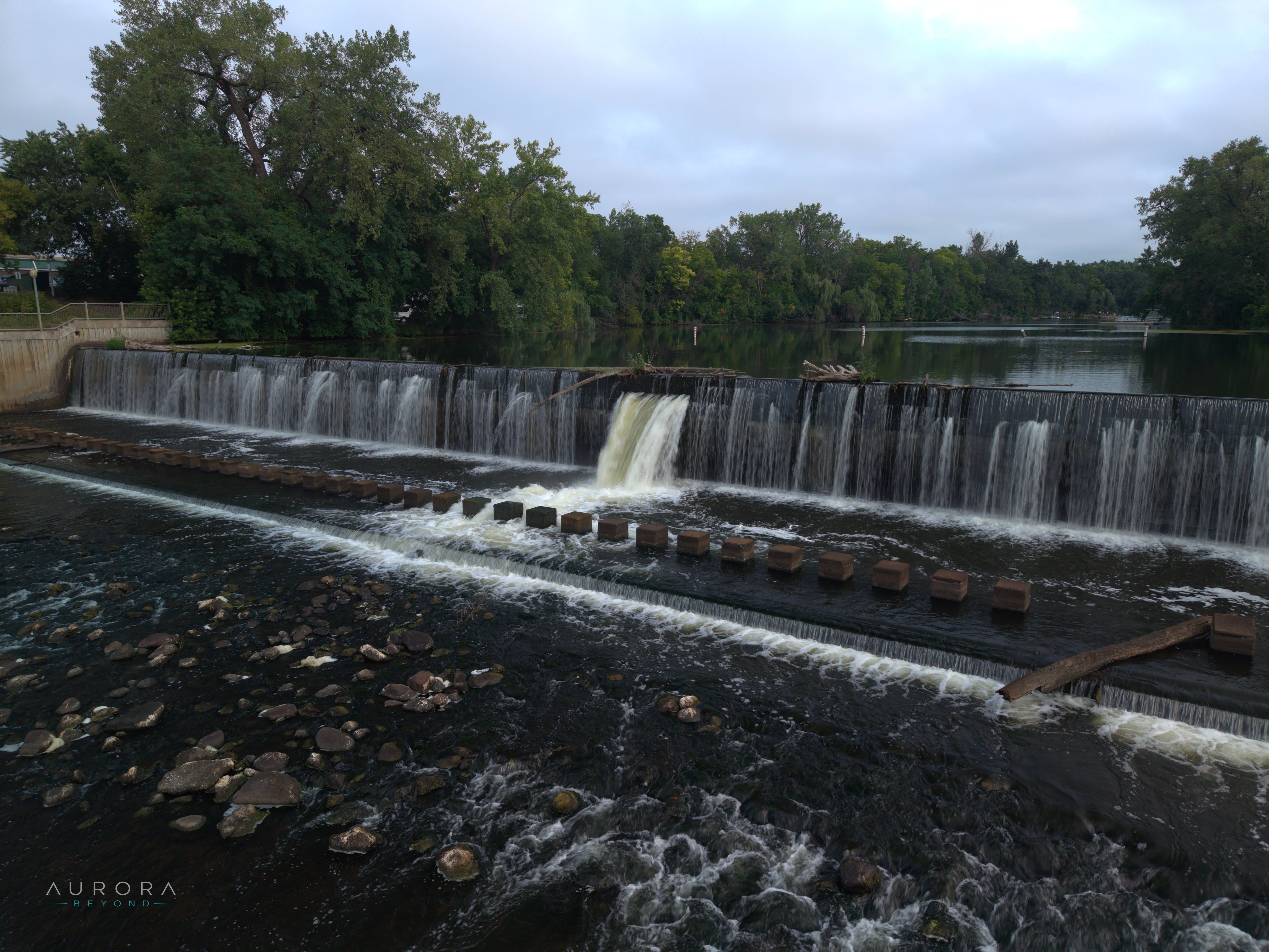 The Rum River dam at Anoka seen low across the water