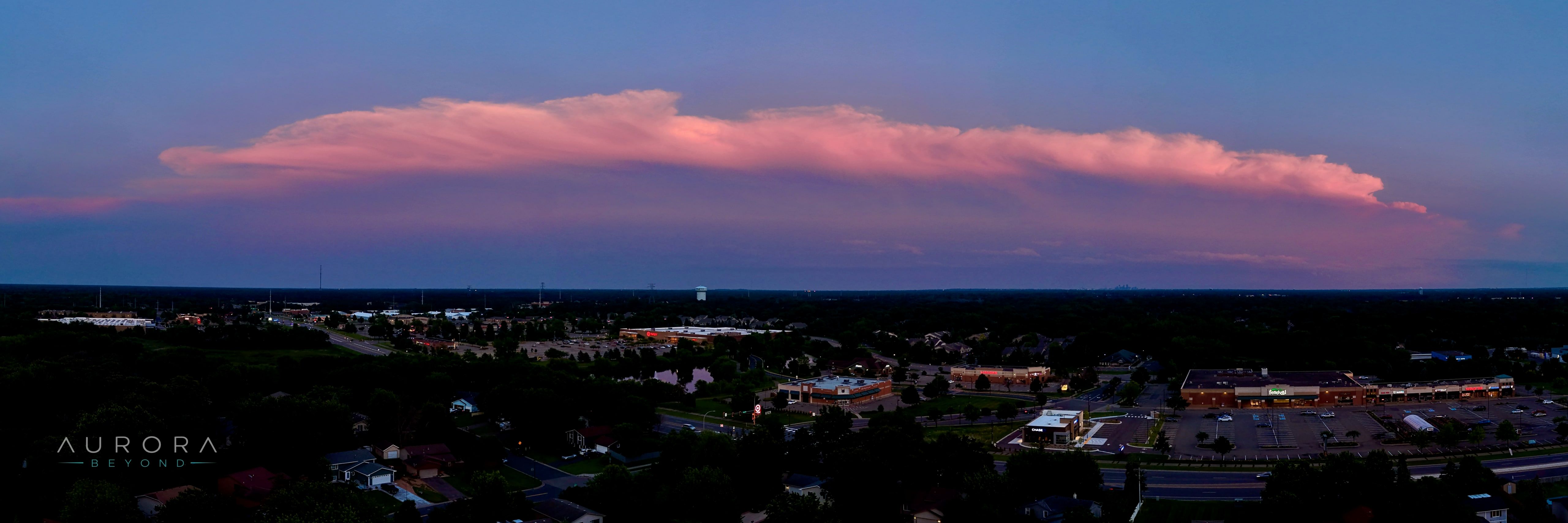 A wide band of pink cloud at dusk stretching across the horizon