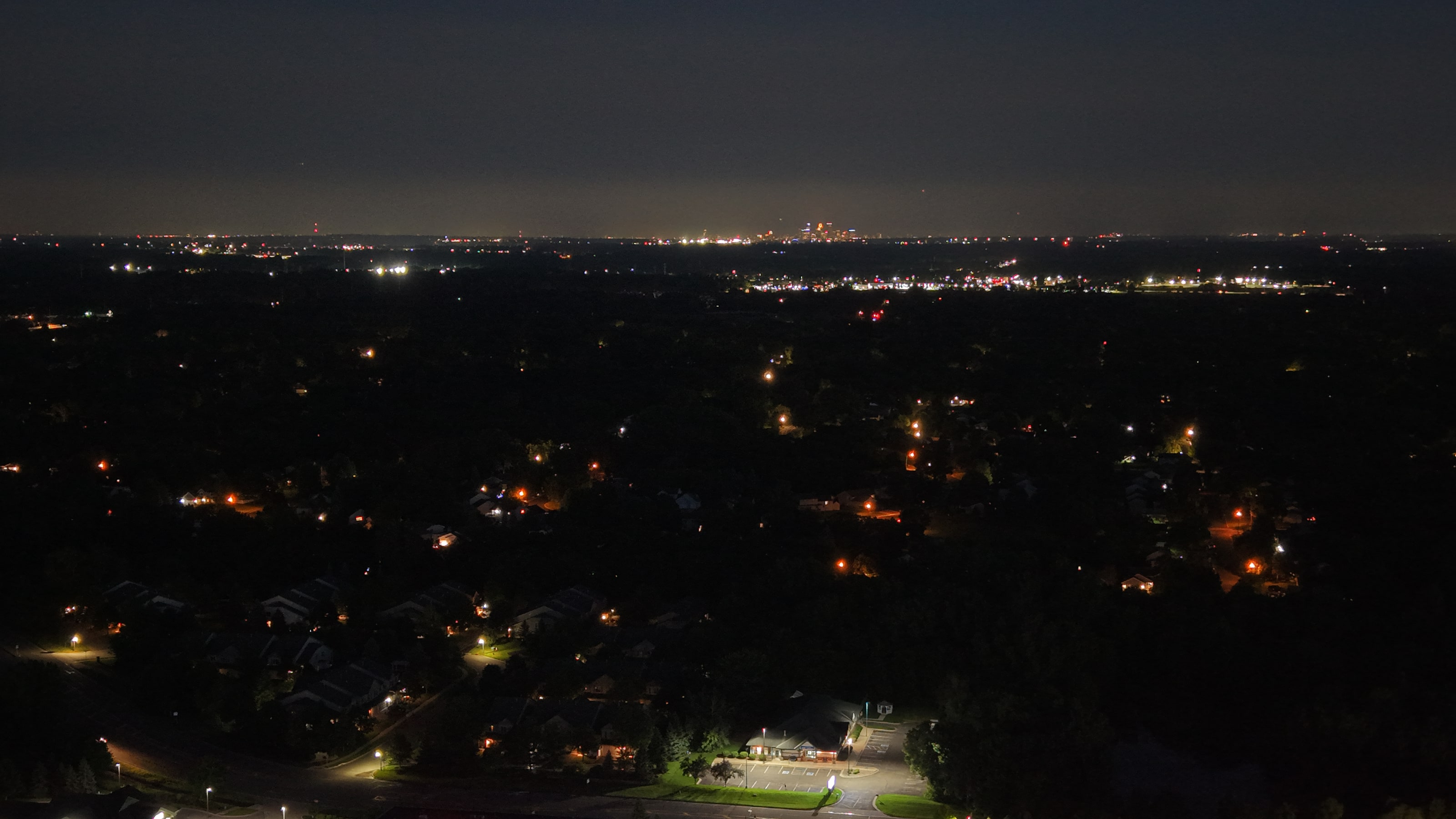 Evening aerial view across water and shoreline
